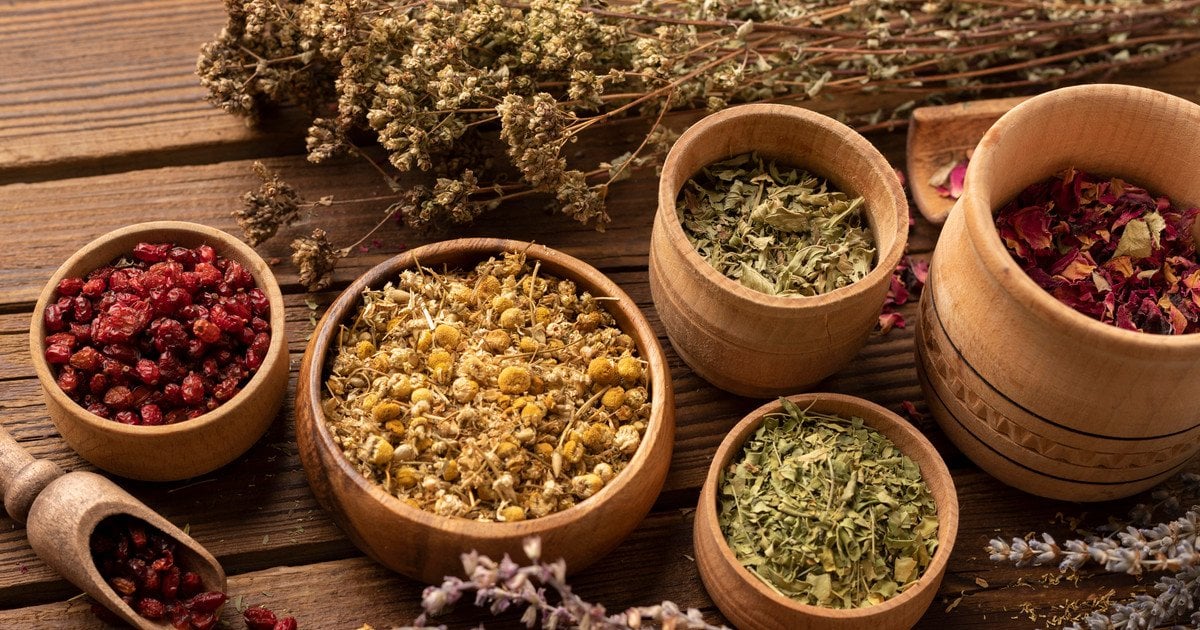 Assorted herbal teas and seasonal tea sets displayed on a wooden table